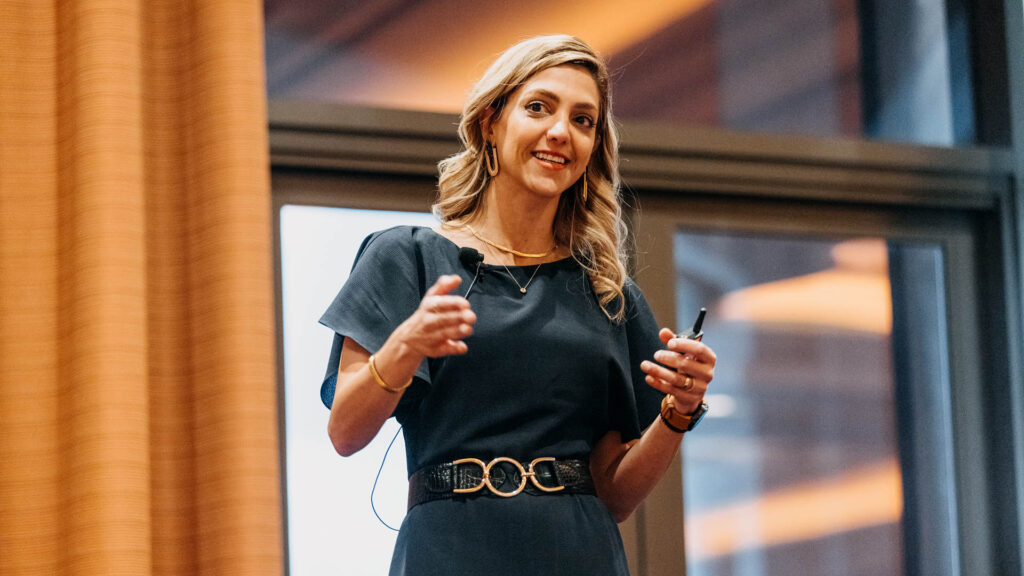 A presenter on the breakout stage at Medallia Experience