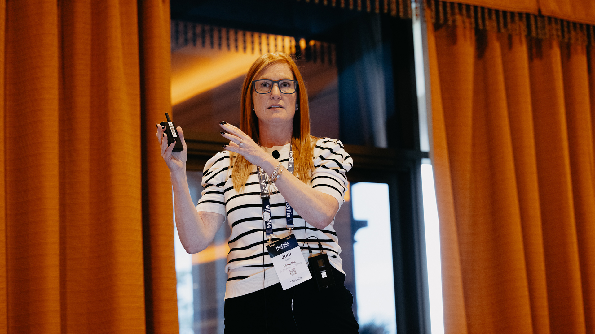 A breakout presenter on stage at Medallia Experience '25