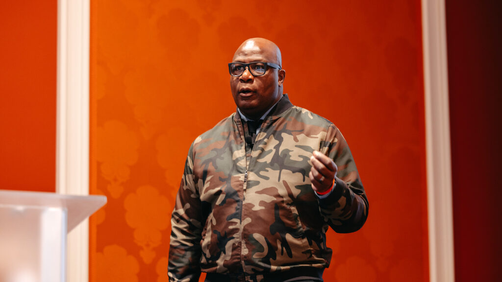 A breakout presenter on stage at Medallia Experience '25