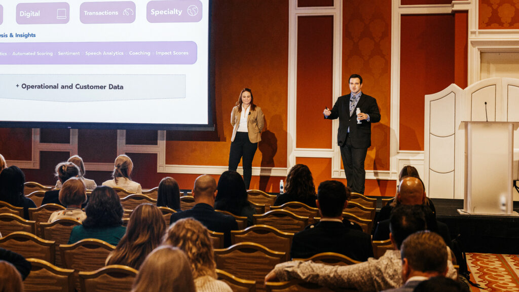 Breakout presenters on stage in front of an audience at Medallia Experience 25