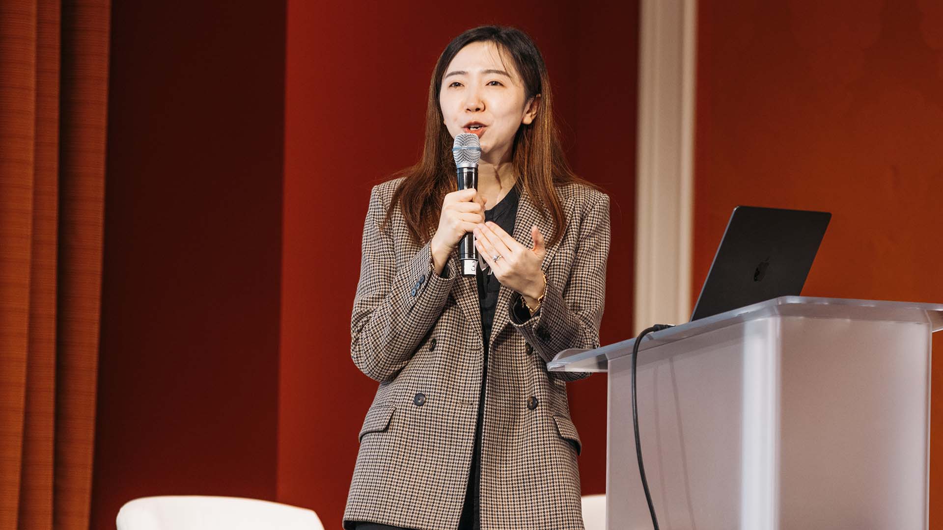 Breakout presenter on stage at Medallia Experience '26.