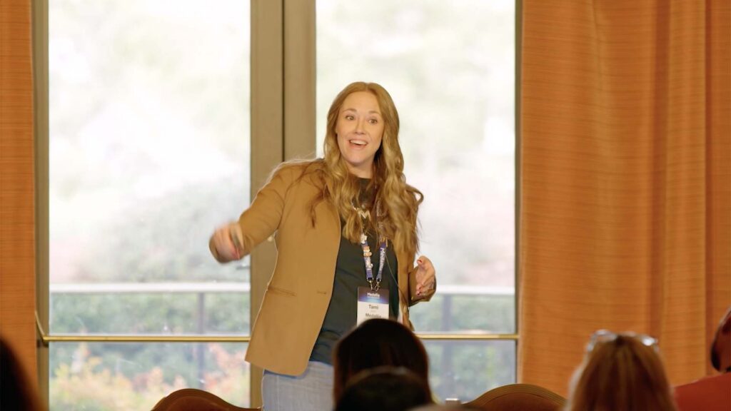 Breakout presenter on stage at Medallia Experience '26.