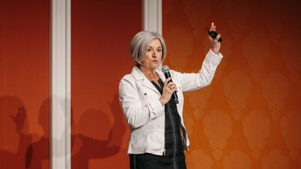 Breakout presenter on stage at Medallia Experience '26.