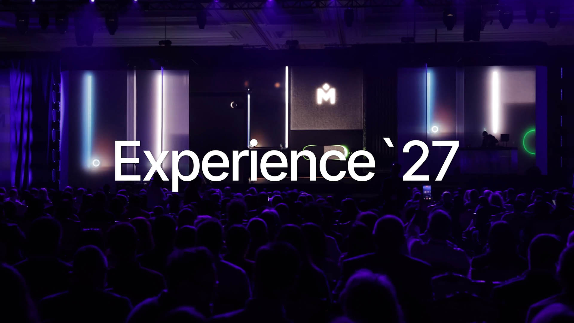 Experience '27 overlaying a photo of the audience