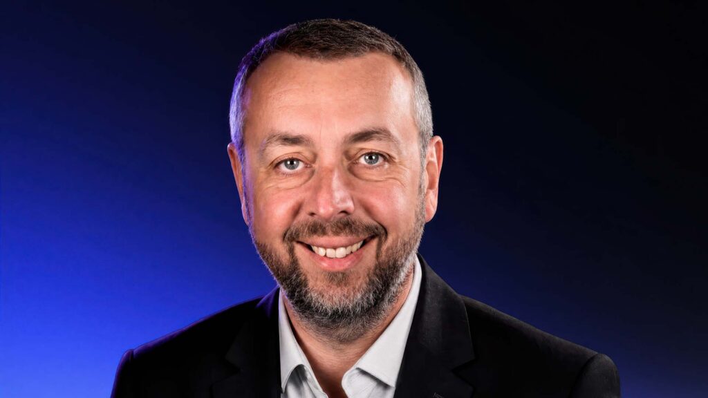 Simon Ball, CX Changemaker, addressing the camera