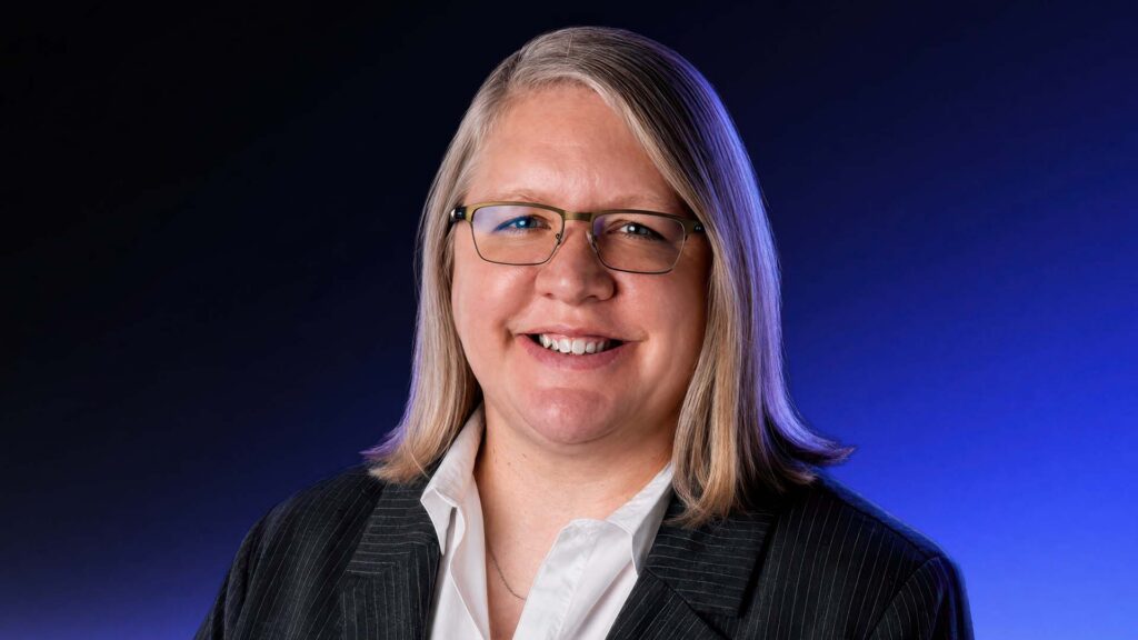 Wendy Lustig, CX Changemaker, addresses the camera