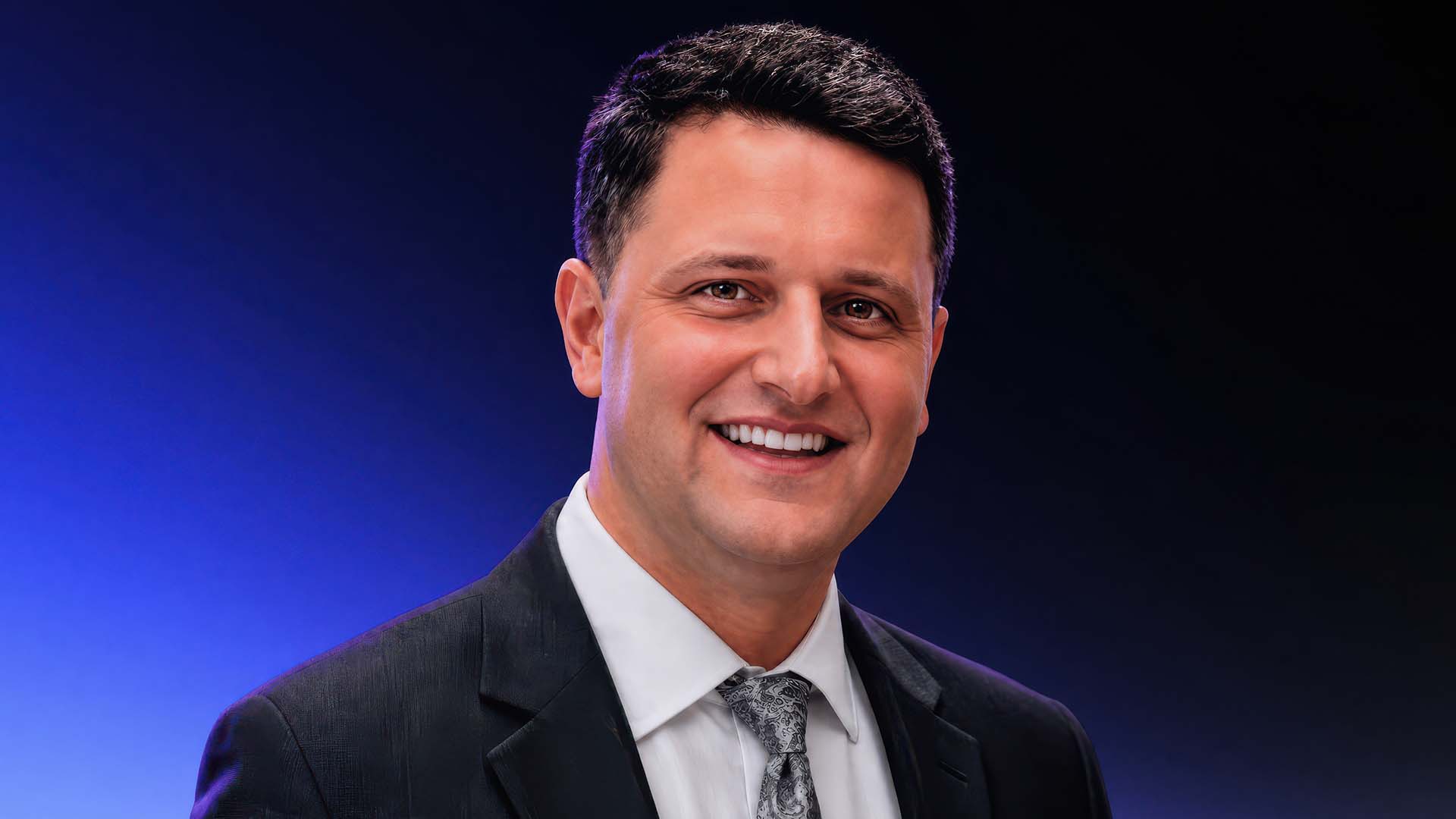 Chad Rogers, CX Changemaker, addresses the camera